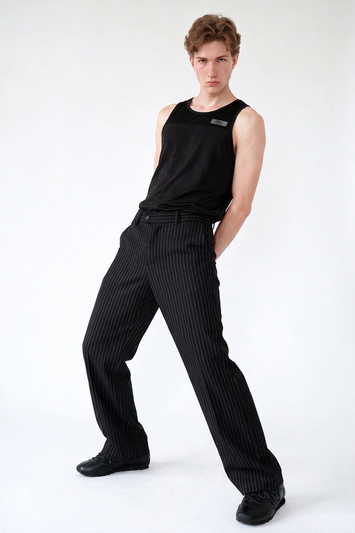 Sovereign Stripe pants in Black — in motion